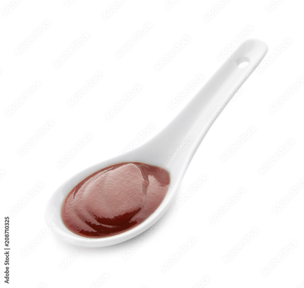 Barbecue sauce in spoon on white background Barbecue sauce in spoon on white background