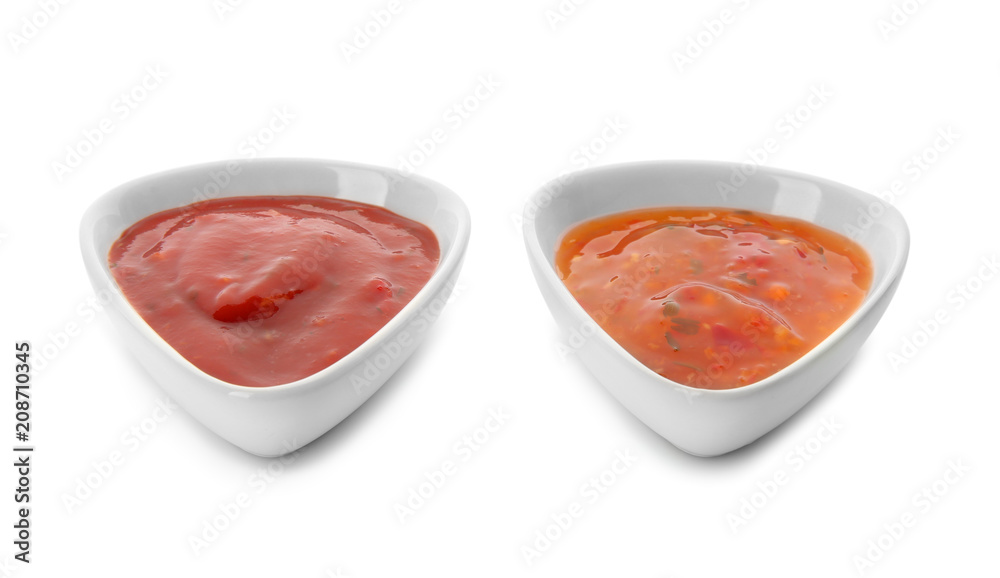 Two bowls with tasty sauces on white background Two bowls with tasty sauces on white background