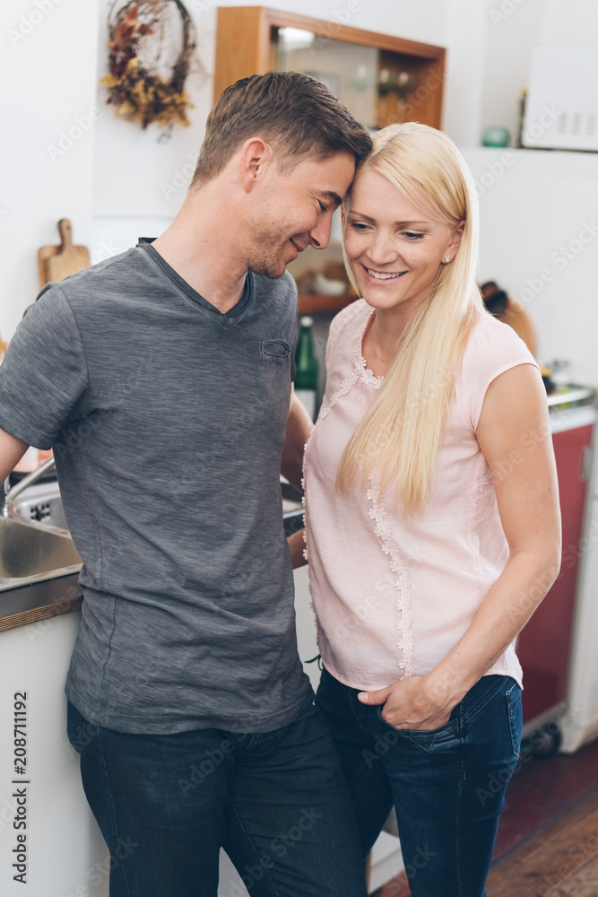 Fototapeta premium Loving couple enjoying a quiet moment in a kitchen