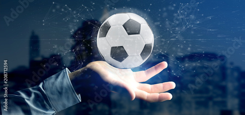 Man holding a Football ball and connection isolated  3d rendering © Production Perig