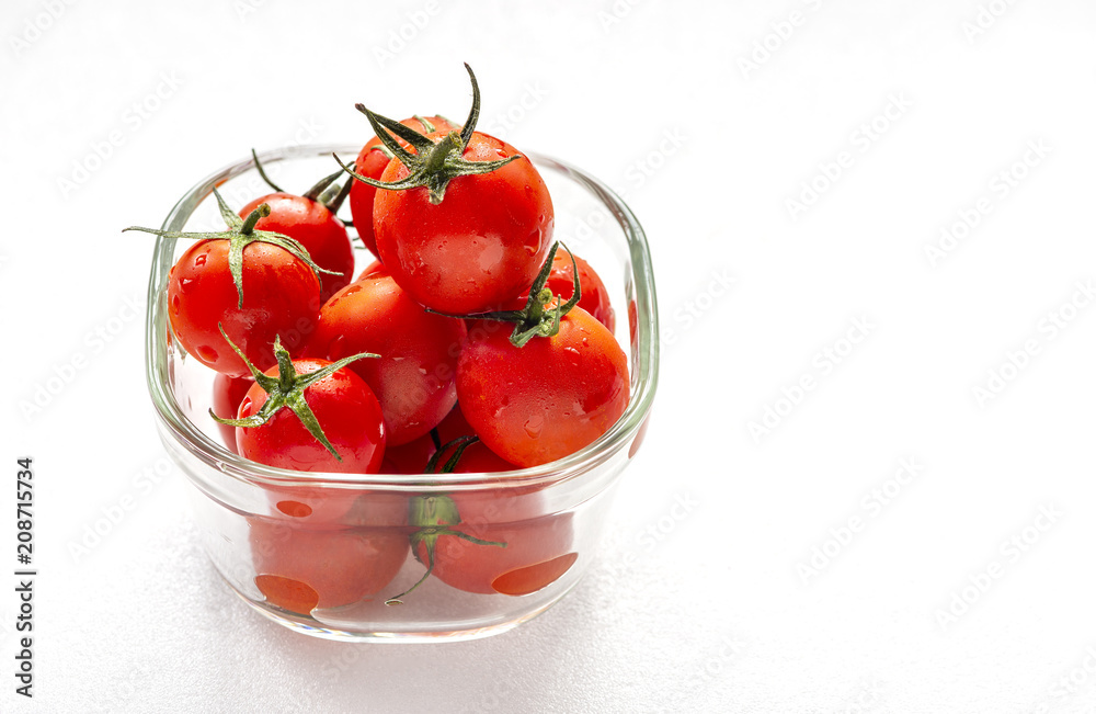 Sweet tomatoes in glass container Sweet tomatoes in glass container