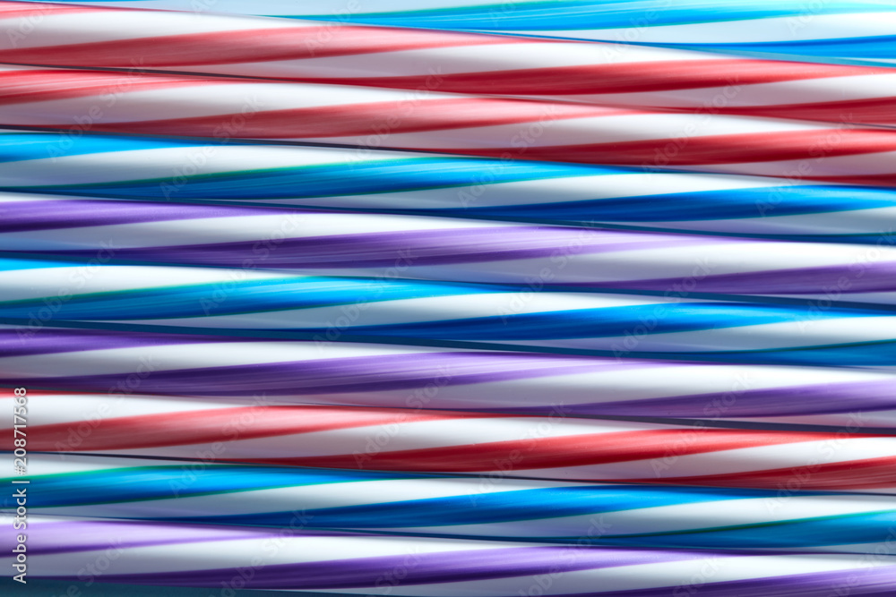 Background of Striped drink straws in different colors Background of Striped drink straws in different colors