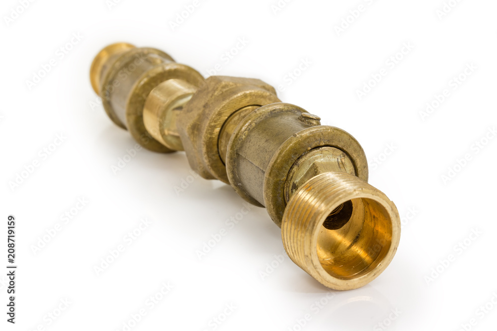 Several connected brass plumbing components at selective focus Several connected brass plumbing components at selective focus