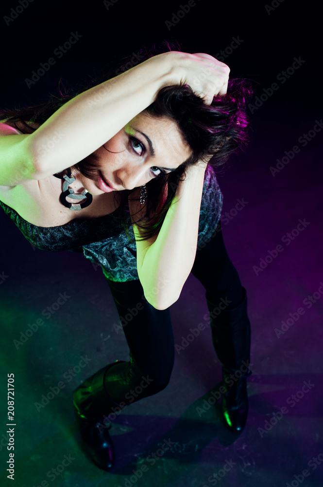 Young caucasian brunette dancing. Top view. Studio shot Young caucasian brunette dancing. Top view. Studio shot