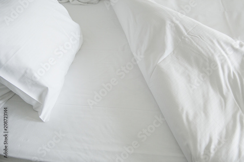 White clean sheets and pillow inviting to go to bed photo