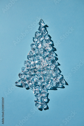 Christmas tree of ice cubes on a blue background