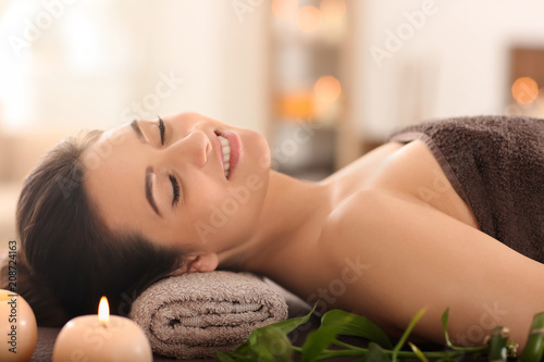 Young woman relaxing on mas...