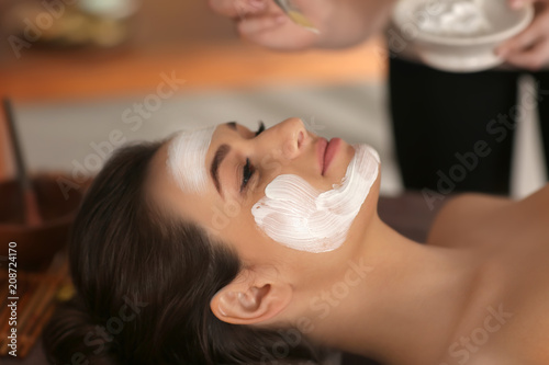 Beautician applying cosmeti...