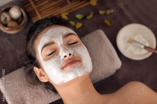 Young woman with face mask ...