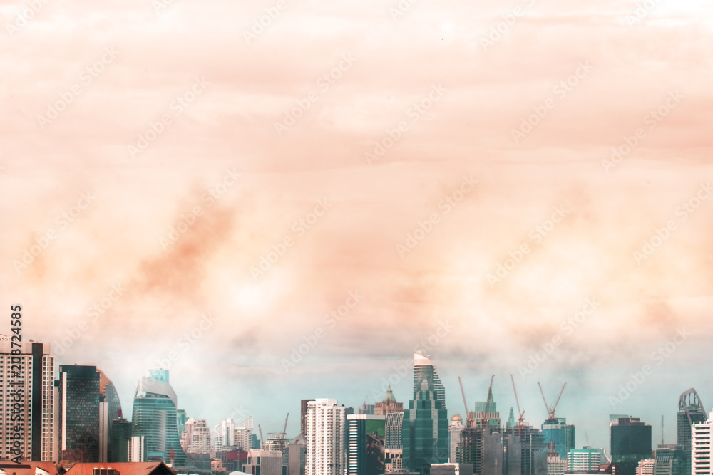 Fototapeta premium Bird view over cityscape with sun and clouds in the morning.Copy space.Bangkok.Pastel tone