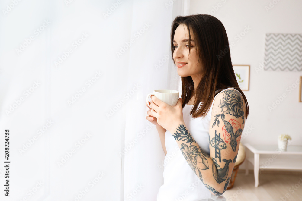 Young beautiful woman drinking coffee at home in morning Young beautiful woman drinking coffee at home in morning