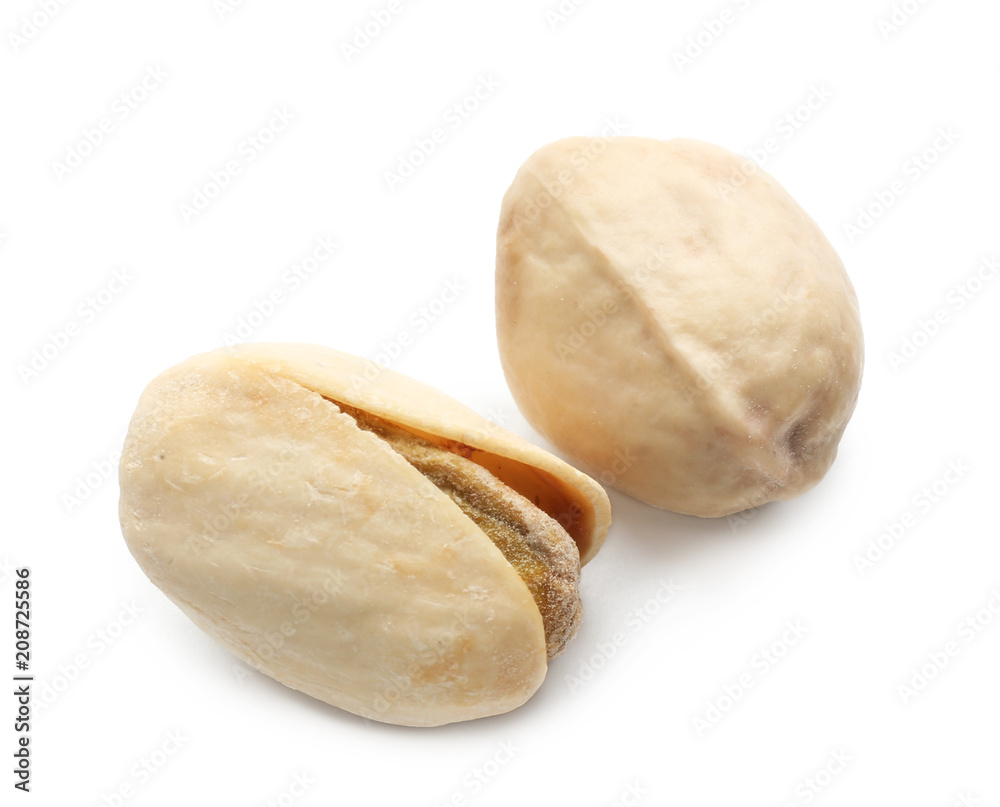 Fototapeta premium Two roasted pistachio nuts with shells, healthy snack food, natural ingredients, isolated on white background