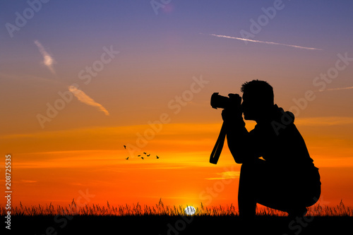 man photographer at sunset