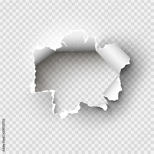 Hole torn in ripped paper on transparent