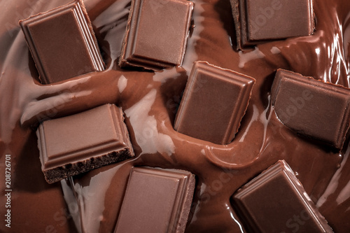 Tasty melted and solid chocolate, closeup