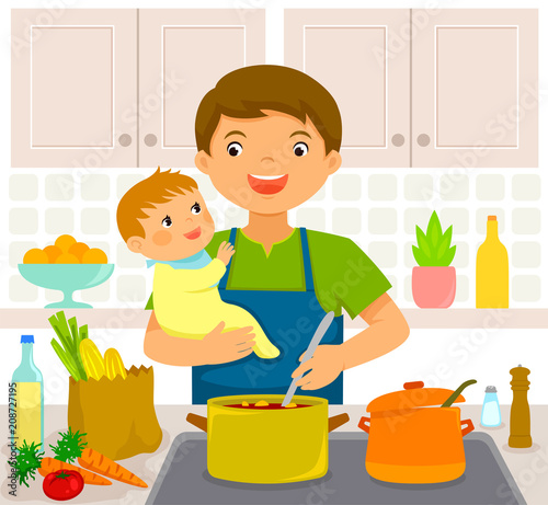 Young man cooking in the kitchen while holding a baby