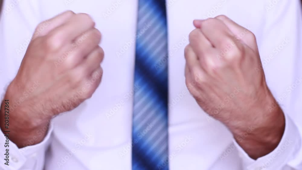 Businessman rotating his hands and doing gymnastics Businessman rotating his hands and doing gymnastics