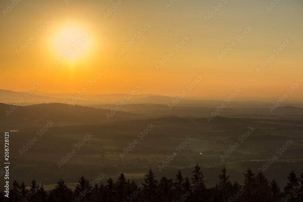 Nice sunset on hills with sun from kravi mountains, Czech landscape