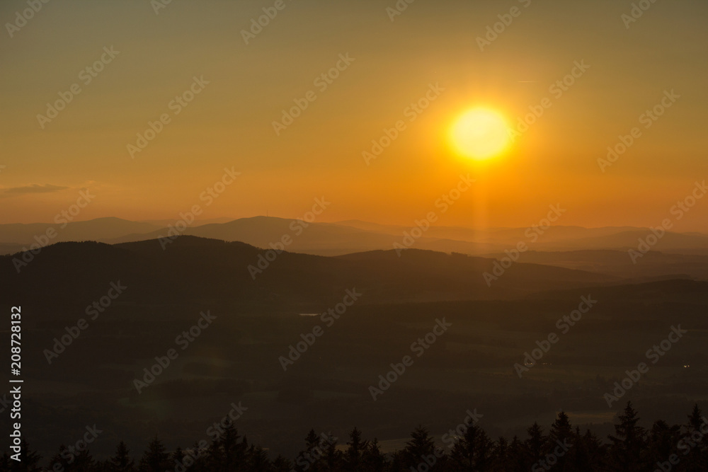 Amazing sunset on hills with sun from kravi mountains, Czech landscape
