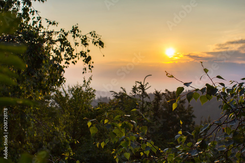 Amazing sunrise through trees with mysty fog, Mandelstein, Austria