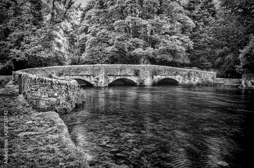 Medieval three arch sheep wash bridge in the Peak District National park. photo