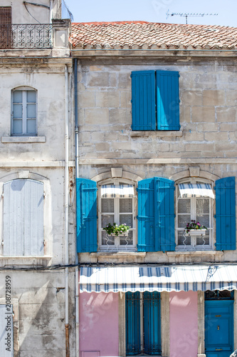 Pretty window facade  with flowers in Arles, Provence, France © Melinda