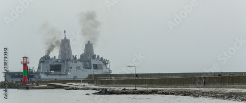 LANDING CRAFT - An American warship sails out of the harbor 