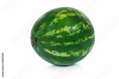 Single whole watermelon isolated on a white background in close-up