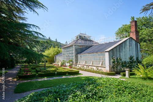 Botanical garden of Sežana, 19th century, Slovenia A 150-years old cedar, flowerbeds, blooming pergolas and the palmarium - garden of joy photo