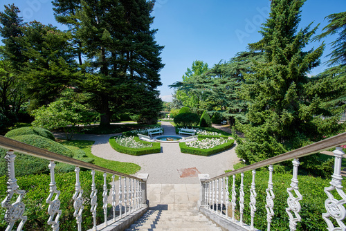 Botanical garden of Sežana, 19th century, Slovenia A 150-years old cedar, flowerbeds, blooming pergolas and the palmarium - garden of joy photo