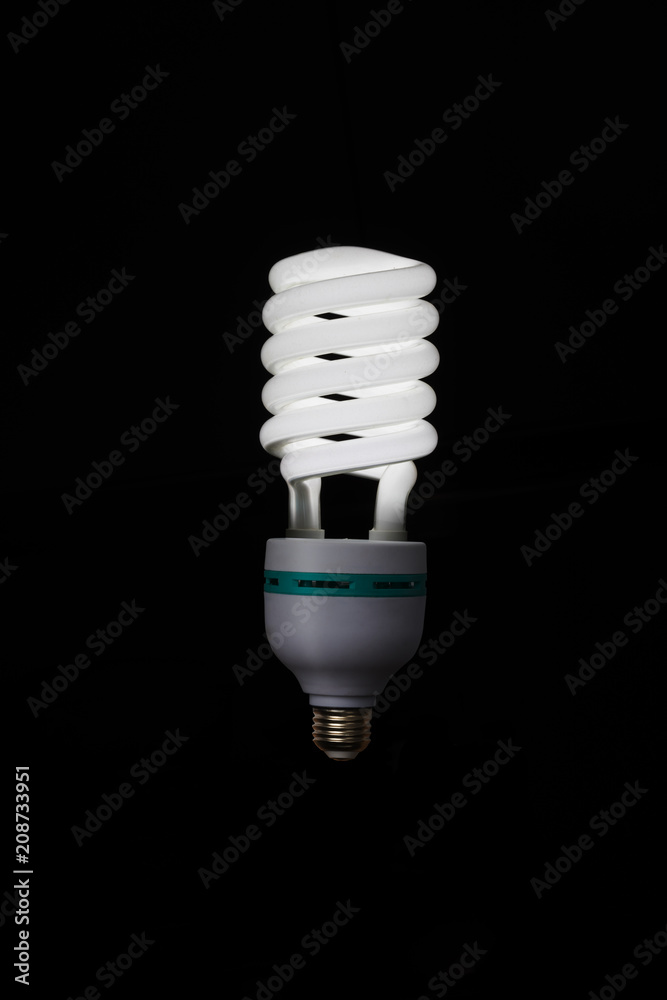 Illuminated light bulb on black background Illuminated light bulb on black background