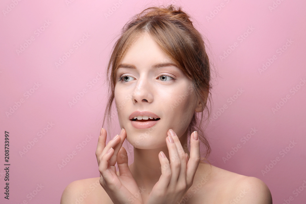 Beautiful young woman with silky skin on color background Beautiful young woman with silky skin on color background