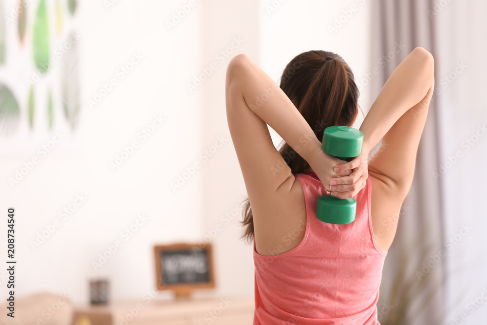 Beautiful young woman doing exercises in morning Beautiful young woman doing exercises in morning