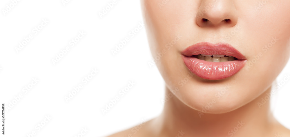 beautiful female lips with lip gloss on white background beautiful female lips with lip gloss on white background