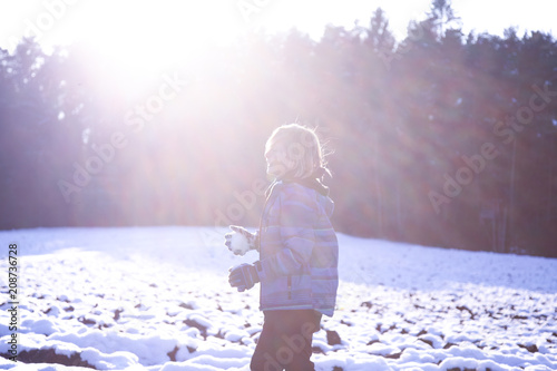 child at snowball fight photo