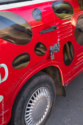 alarm system on the red car, anti-theft system on the car
