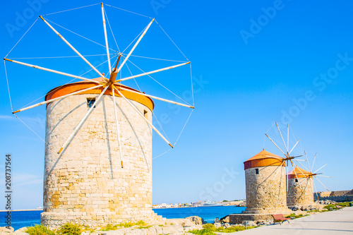 The historic windmills at Mandraki harbour in Rhodes Town, Mediterranean Sea, Greece