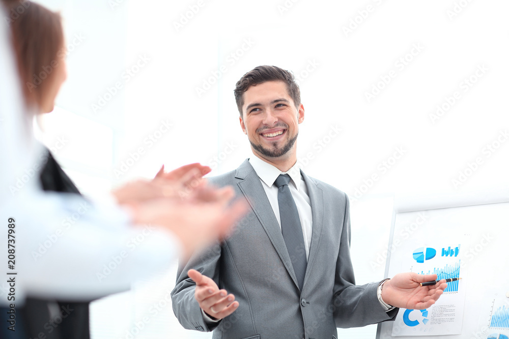 business team applauding the speaker after the business presentation. business team applauding the speaker after the business presentation.
