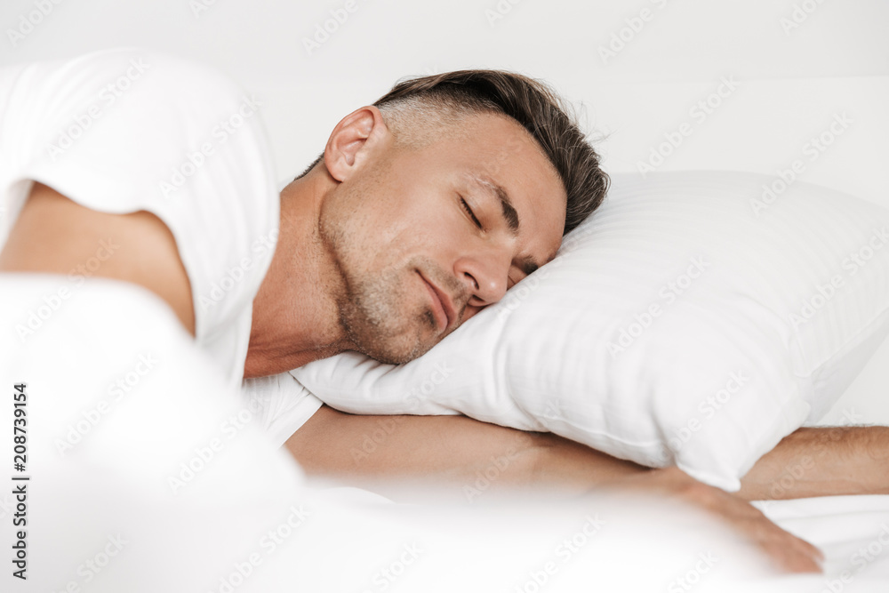 Handsome man sleeping in bed Handsome man sleeping in bed