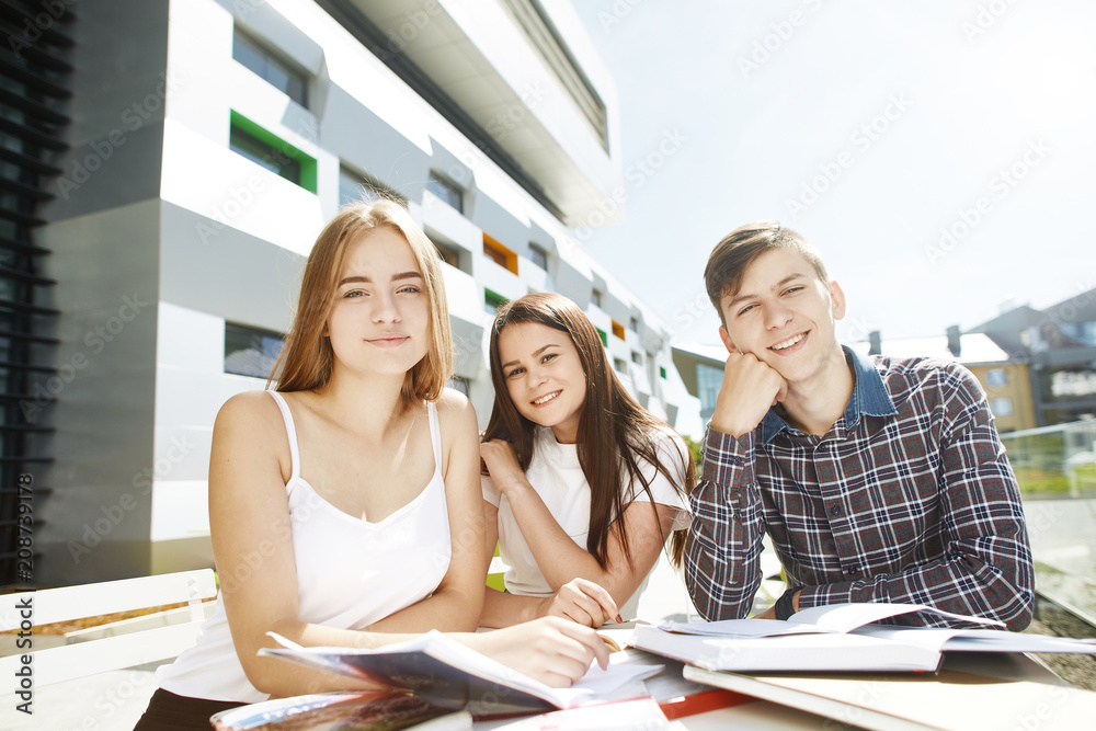Portrait of three happy high school students Portrait of three happy high school students