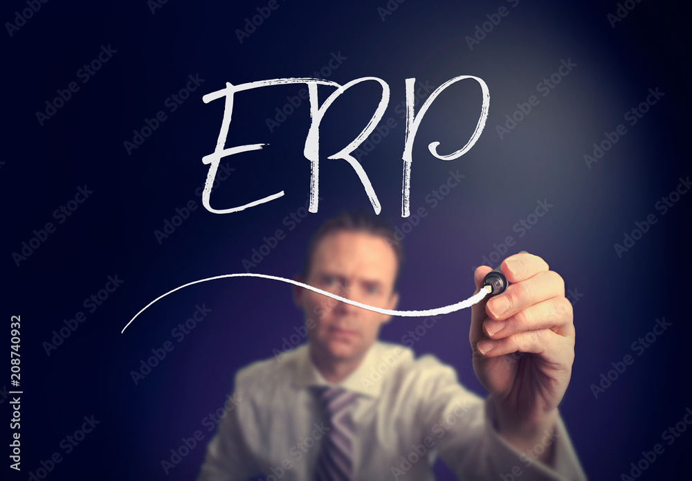 A businessman writing a ERP concept with a white pen on a clear screen. A businessman writing a ERP concept with a white pen on a clear screen.