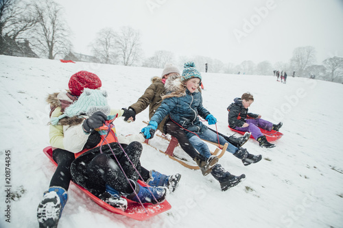 Children Having a Sledding Race photo