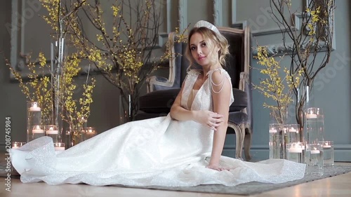 Blonde bride in fashion white wedding dress with makeup