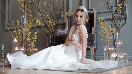 Blonde bride in fashion white wedding dress with makeup