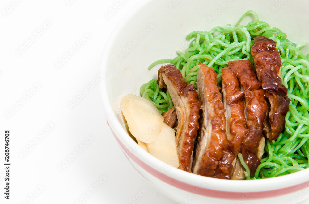 Green noodles with duck in bowl.