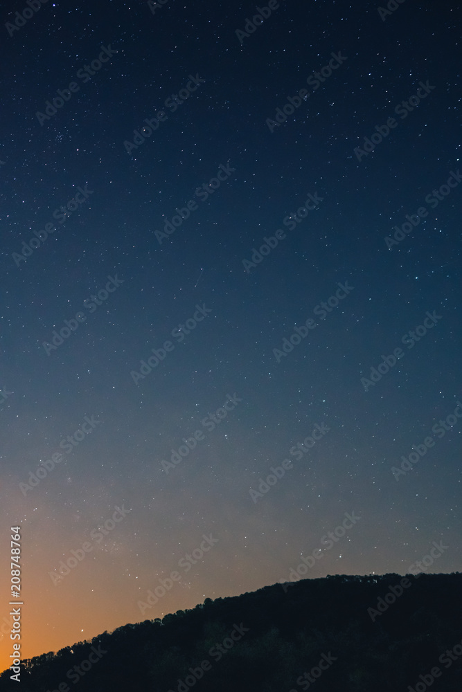Fototapeta premium a beautiful view of the starry sky, and mountains, the sky full of stars, vertical photo
