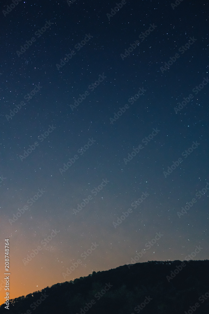 a beautiful view of the starry sky, and mountains, the sky full of stars, vertical photo