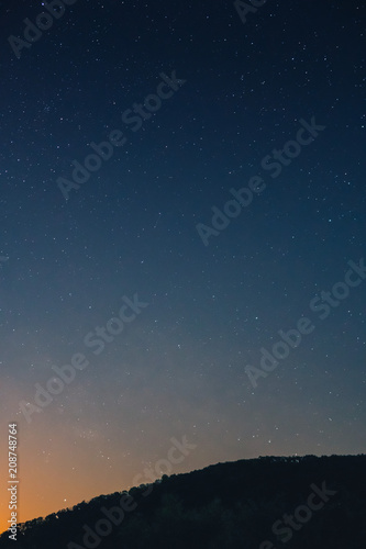 a beautiful view of the starry sky, and mountains, the sky full of stars, vertical photo