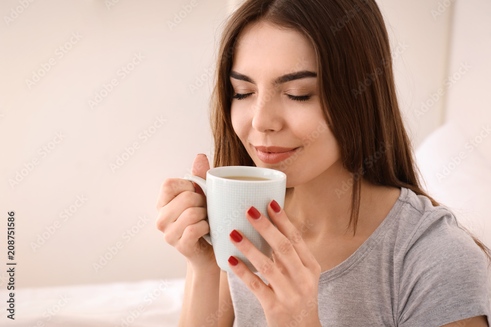 Morning of beautiful young woman drinking coffee at home Morning of beautiful young woman drinking coffee at home