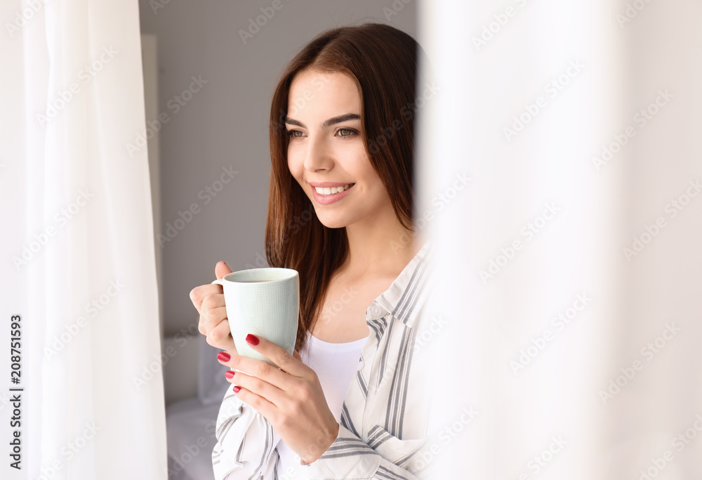 Morning of beautiful young woman drinking coffee at home Morning of beautiful young woman drinking coffee at home